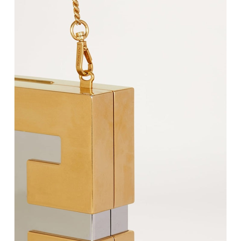 Bolsa Clutch Metal Monogram