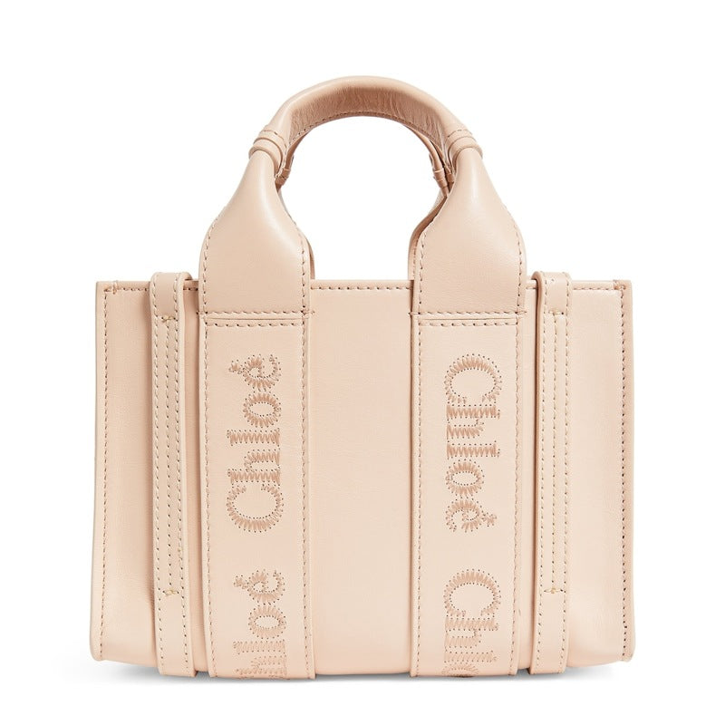 Bolsa Tote Mini Woody - Mercado de Luxo - O Maior E-Commerce de Bens, Produtos e Serviços de Luxo do Brasil.