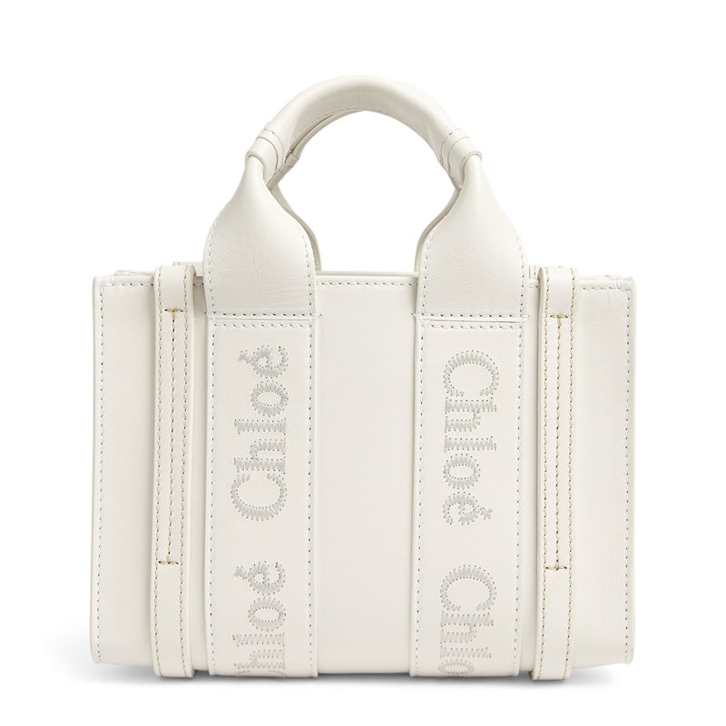 Bolsa Tote Mini Woody - Mercado de Luxo - O Maior E-Commerce de Bens, Produtos e Serviços de Luxo do Brasil.
