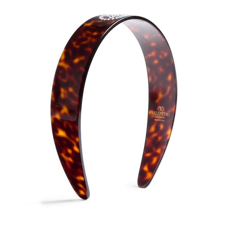 Faixa de cabeça com assinatura VLogo - Mercado de Luxo - O Maior E-Commerce de Bens, Produtos e Serviços de Luxo do Brasil.