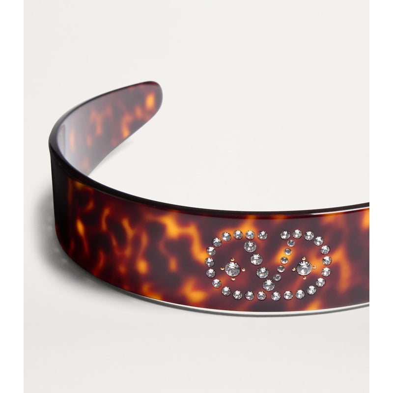 Faixa de cabeça com assinatura VLogo - Mercado de Luxo - O Maior E-Commerce de Bens, Produtos e Serviços de Luxo do Brasil.