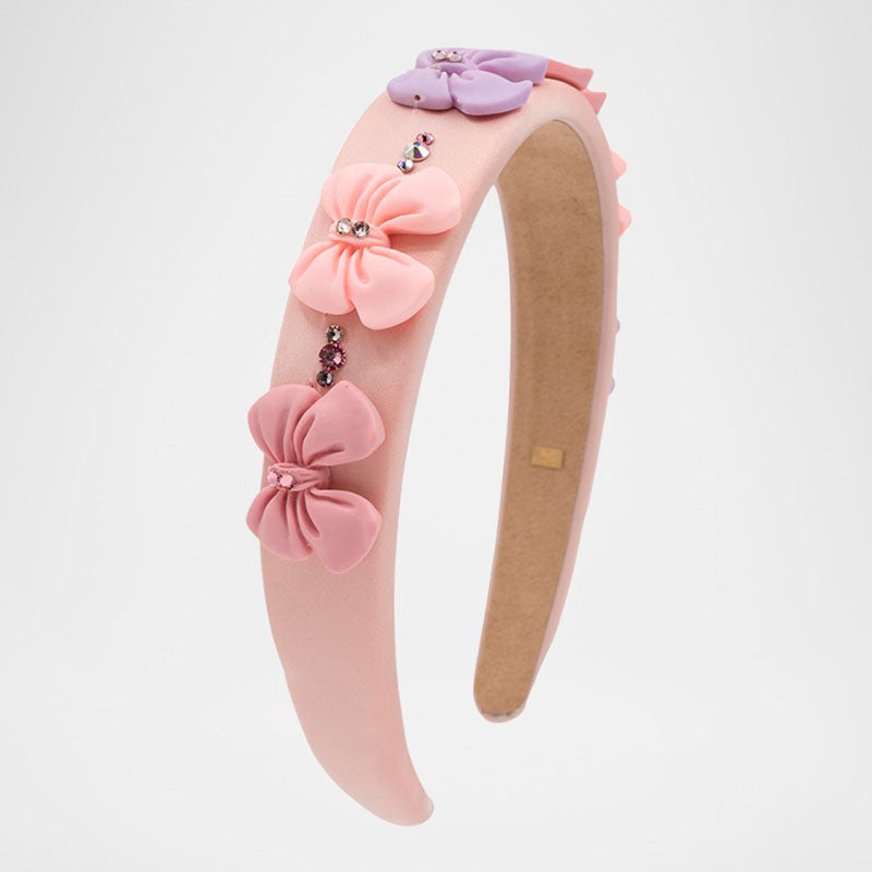 Faixa de cabeça enfeitada com laços pastéis - Mercado de Luxo - O Maior E-Commerce de Bens, Produtos e Serviços de Luxo do Brasil.