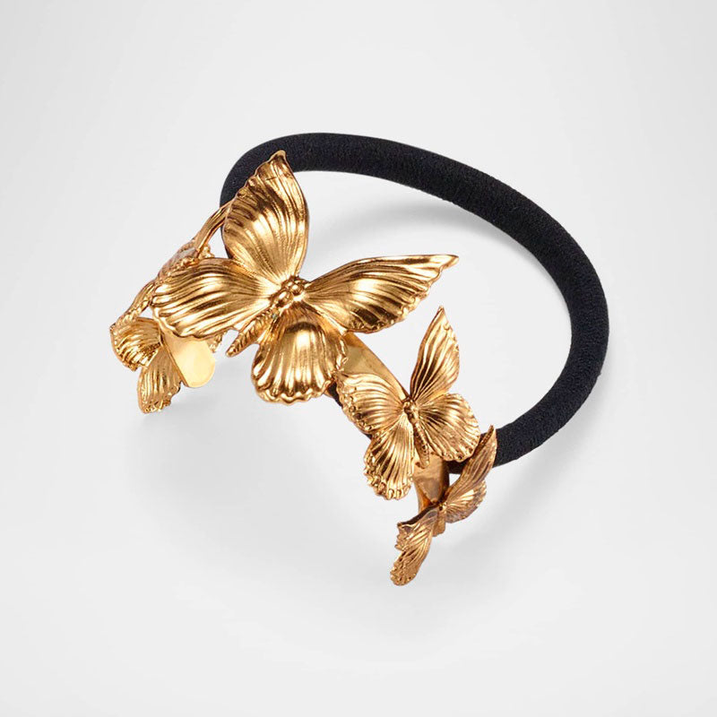 Elástico Silvie Butterfly Pony - Mercado de Luxo - O Maior E-Commerce de Bens, Produtos e Serviços de Luxo do Brasil.